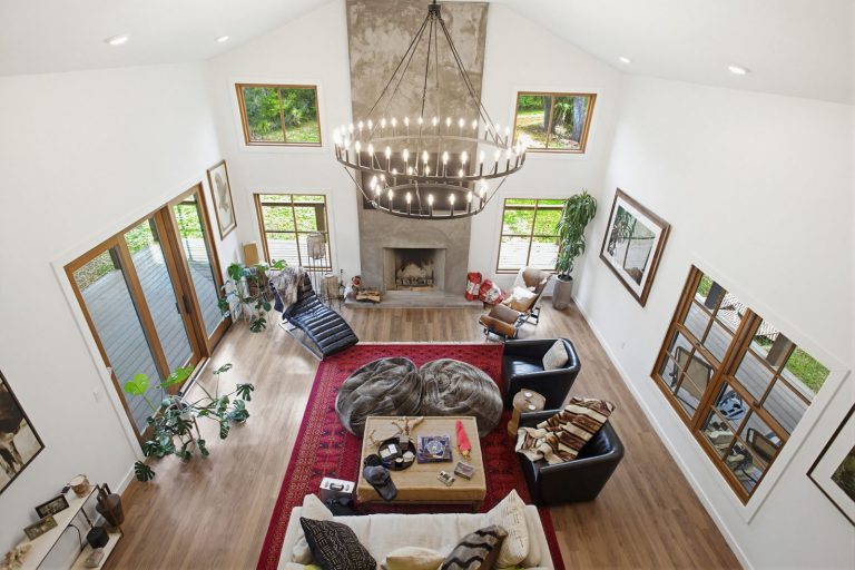 Vaulted great room with stone fireplace and wood floors, Florida home interior photography