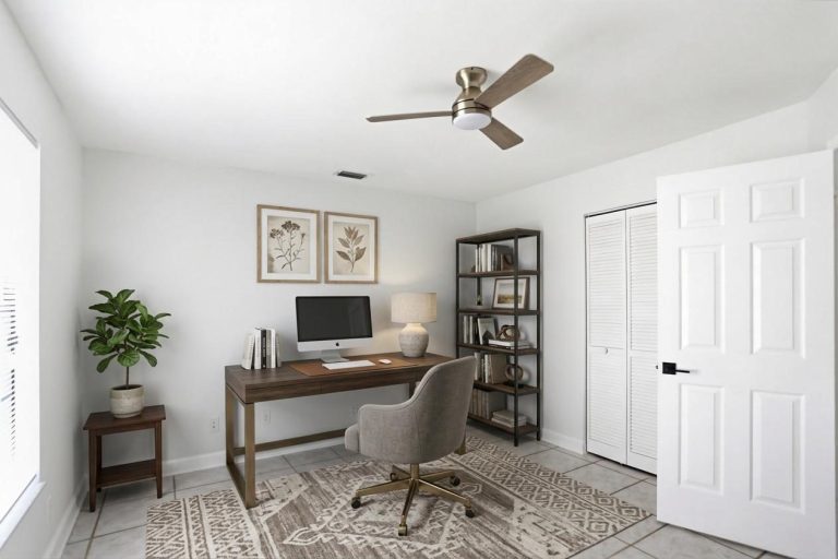Home office with desk, bookshelf and ceiling fan, Florida real estate interior photo