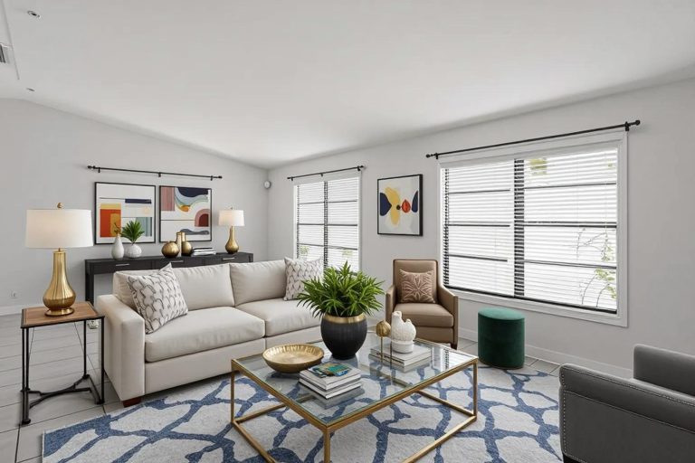 Bright living room with sofa and glass coffee table, Florida real estate photography