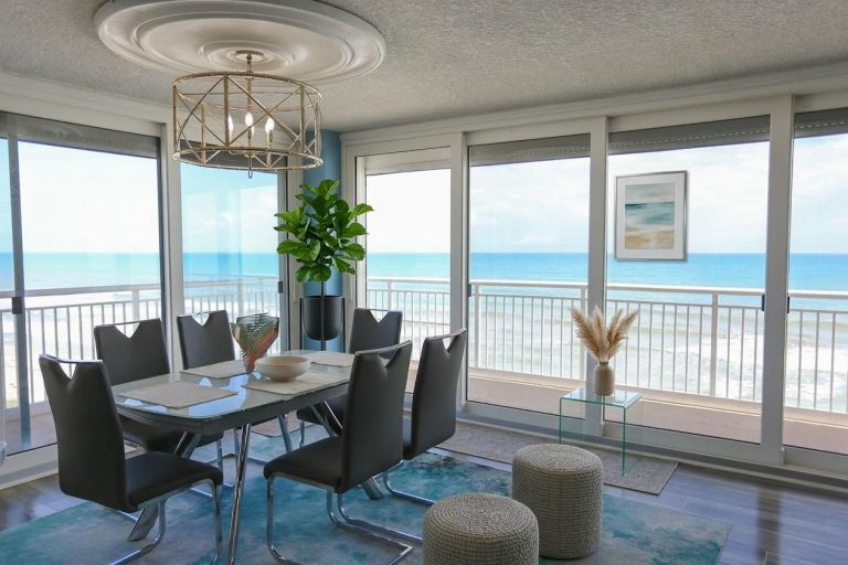 Oceanfront condo dining room with floor-to-ceiling ocean views, Florida real estate photography by 581 Drone Services